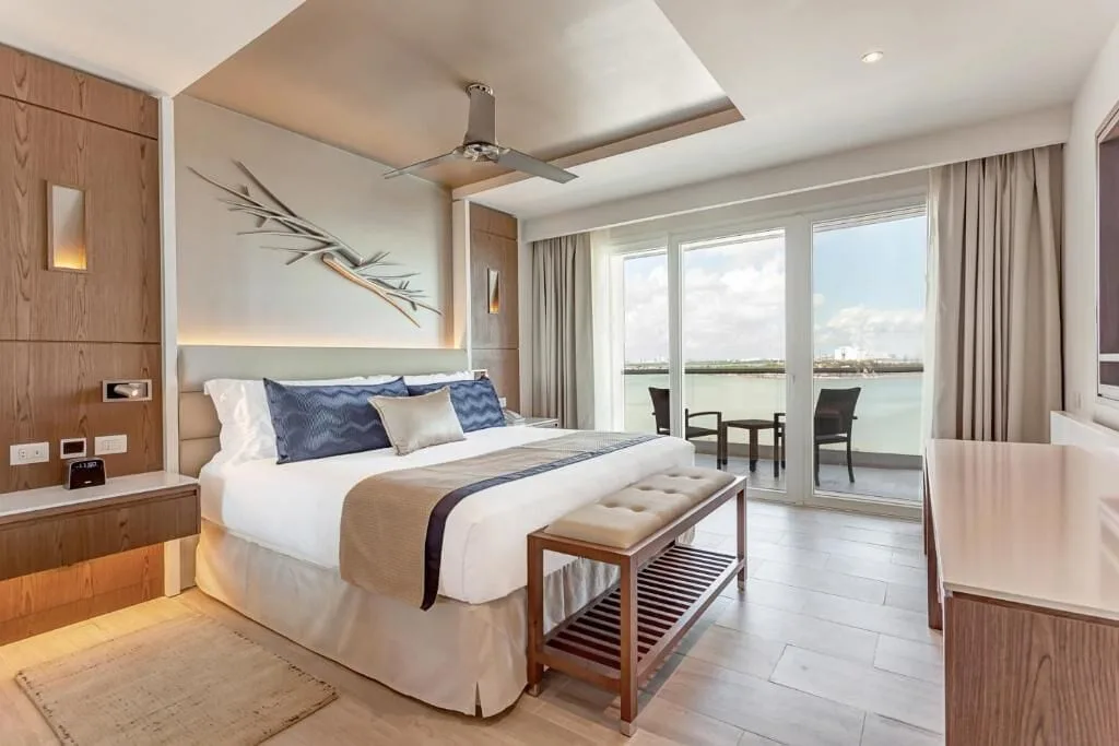 King bedroom with balcony in the Presidential Suite at Royalton CHIC Cancun.