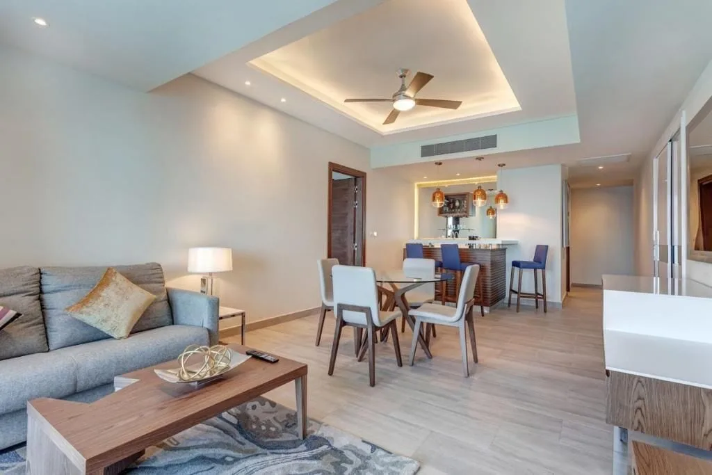 Living and dining area in the Presidential Suite at Royalton CHIC Cancun.