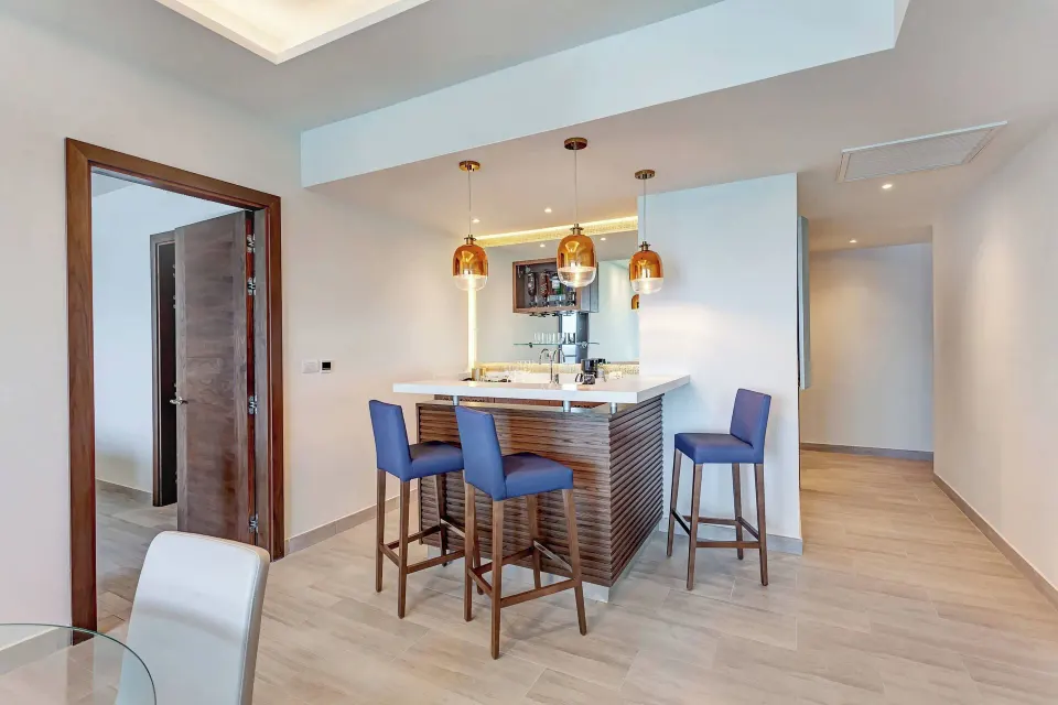 Wet bar and seating area in the Presidential Suite at Royalton CHIC Cancun.
