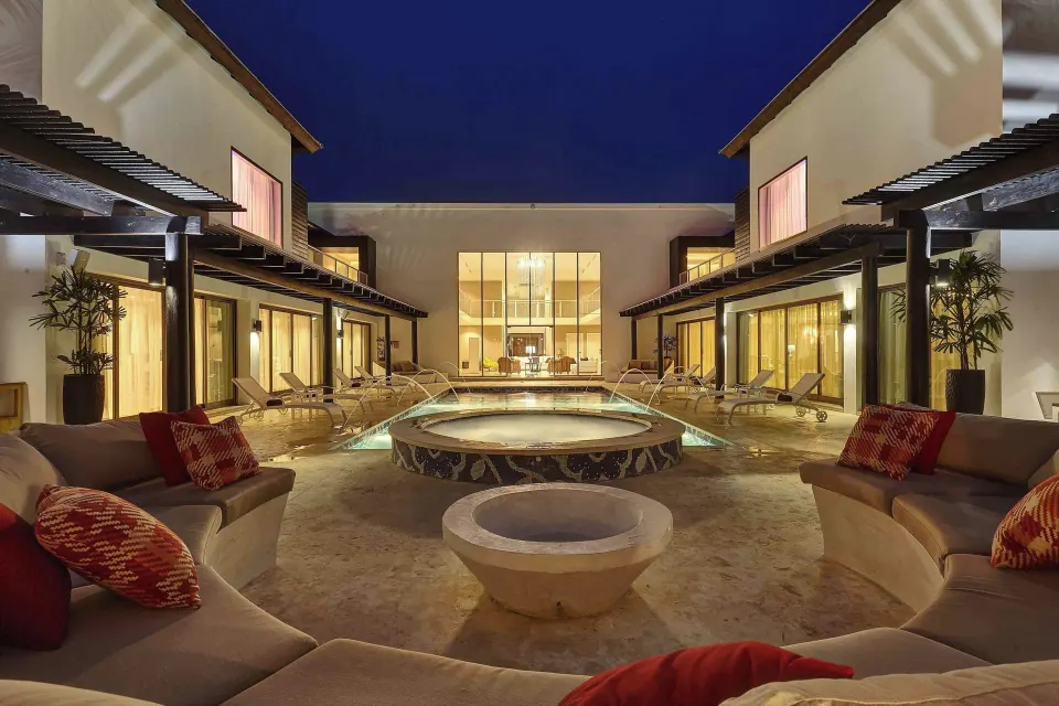Evening courtyard pool with lounge seating at Royalton CHIC Punta Cana Resort & Casino.
