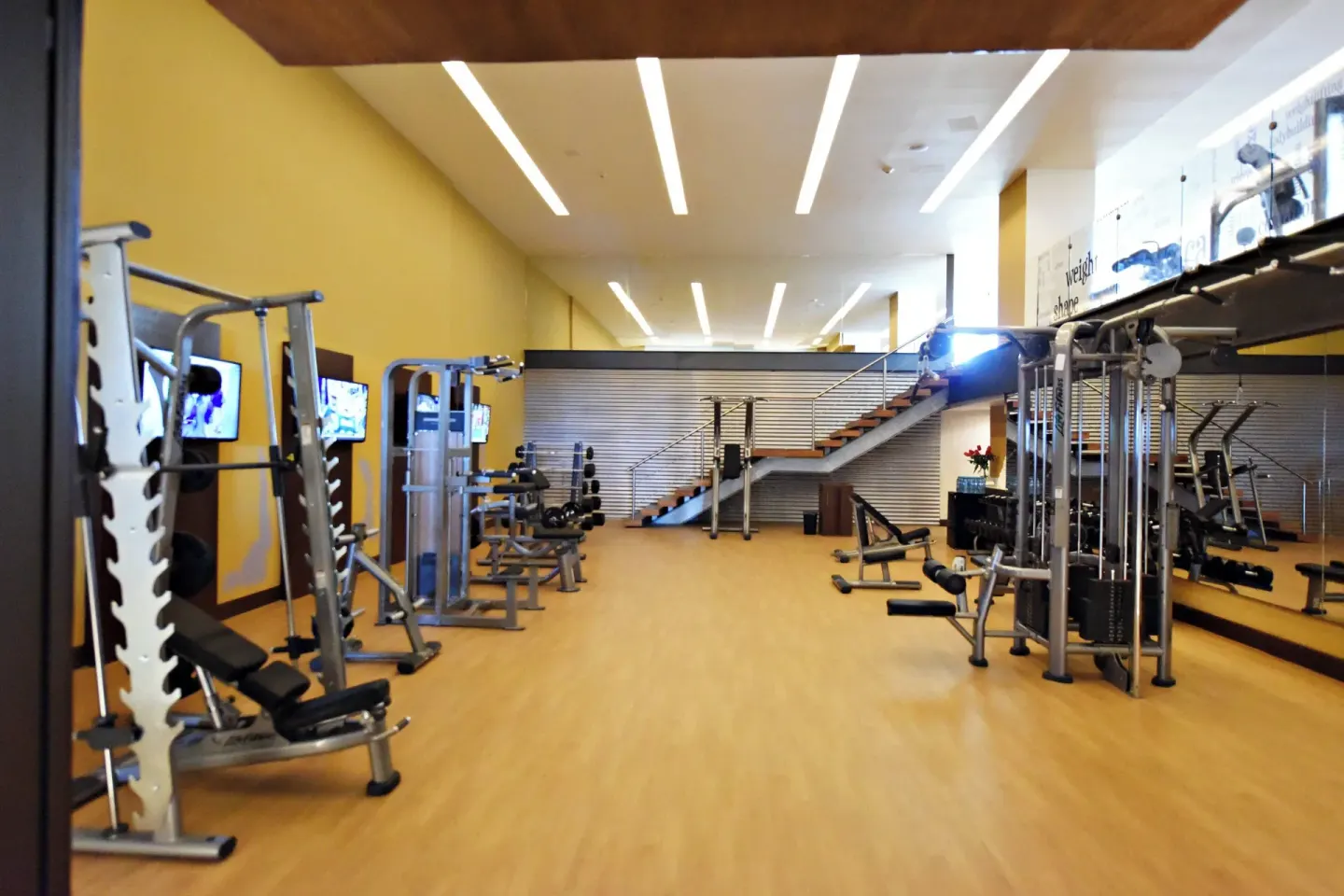 A bright fitness center with strength equipment at Royalton CHIC Punta Cana Resort & Casino.