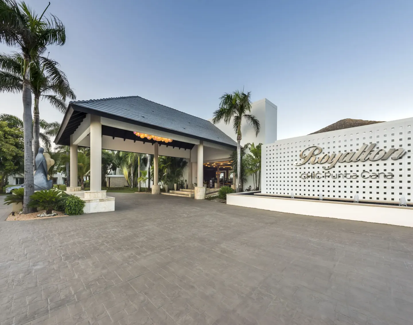 Main entrance sign and covered driveway at Royalton CHIC Punta Cana Resort & Casino.