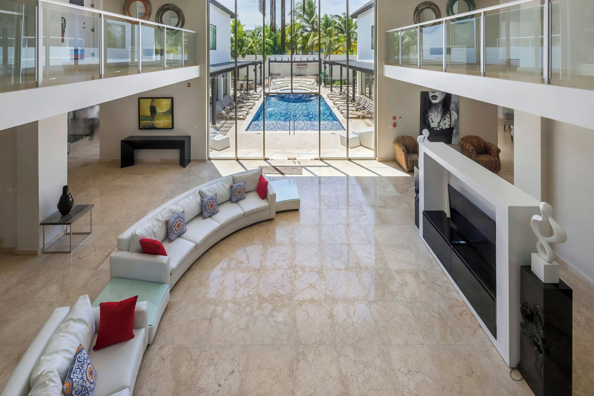 Two-story lounge opening to a pool at Royalton CHIC Punta Cana Resort & Casino.