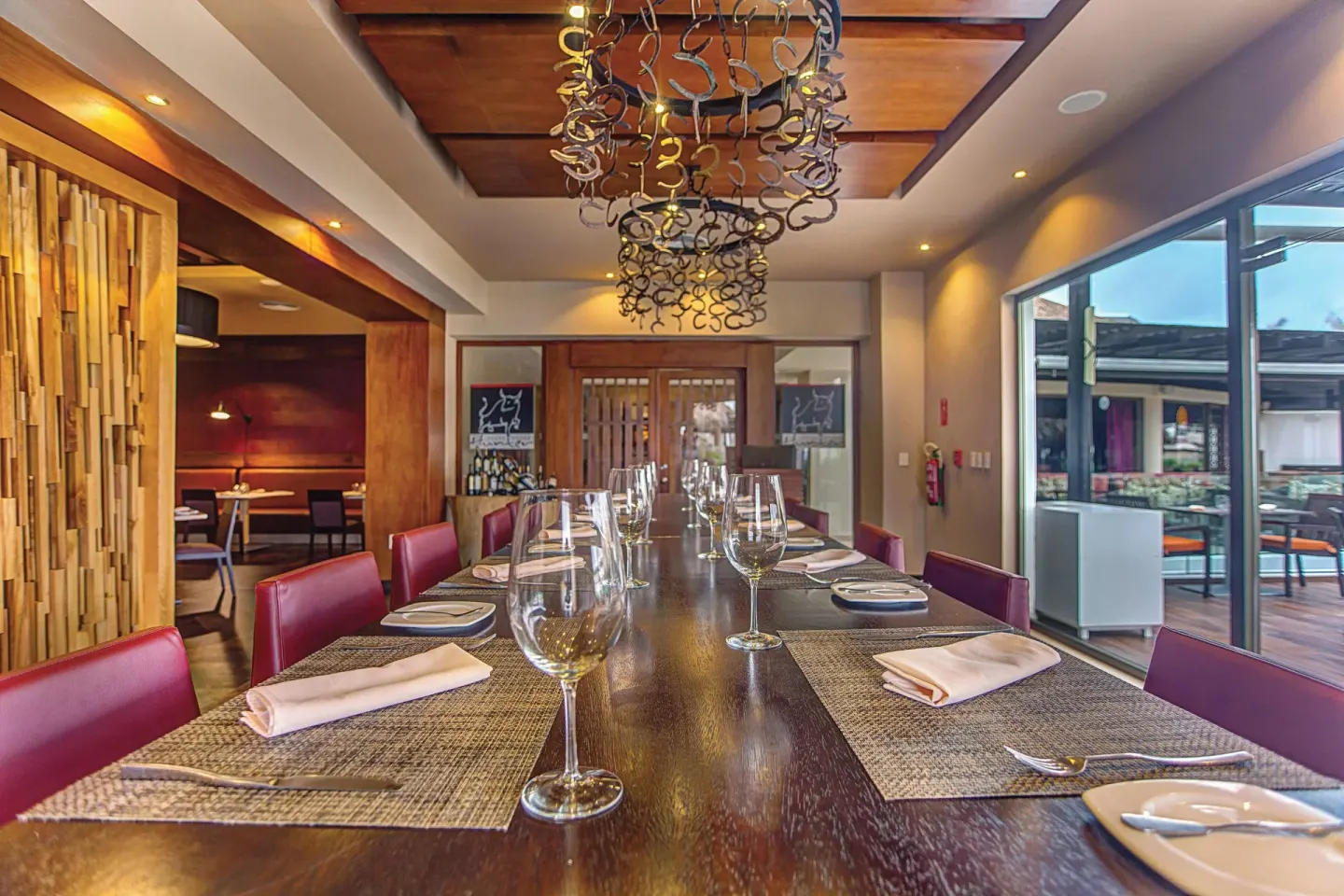 Private steakhouse dining table set with wine glasses at Royalton CHIC Punta Cana Resort & Casino.