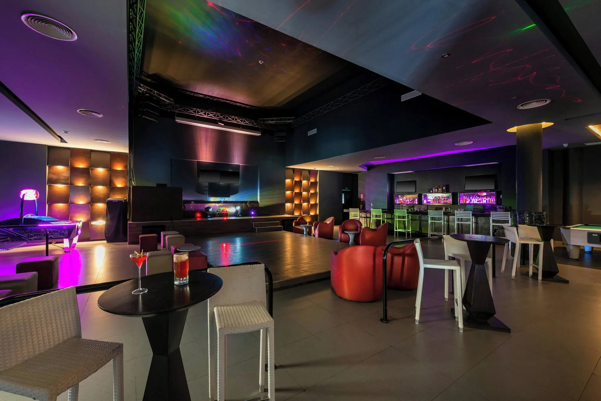 Nightclub-style bar with dance floor and colorful lighting at Royalton CHIC Punta Cana Resort & Casino.