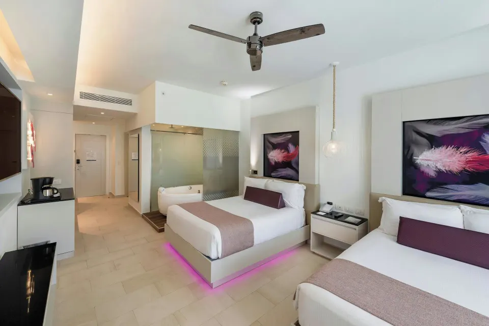 Luxury Junior Suite with two double beds at Royalton CHIC Punta Cana Resort & Casino.