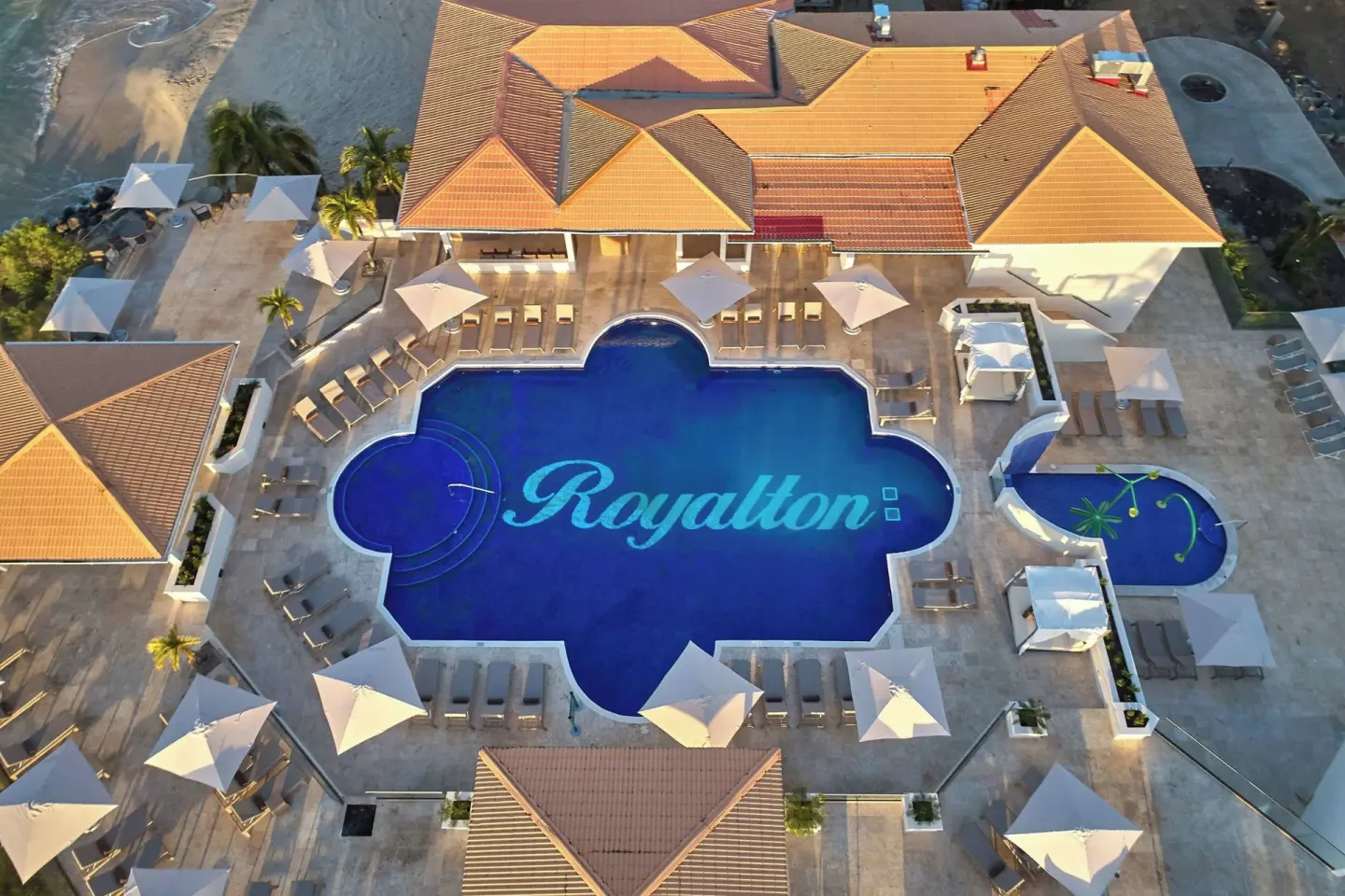 Aerial view of the main pool and surrounding terraces at Royalton Grenada.