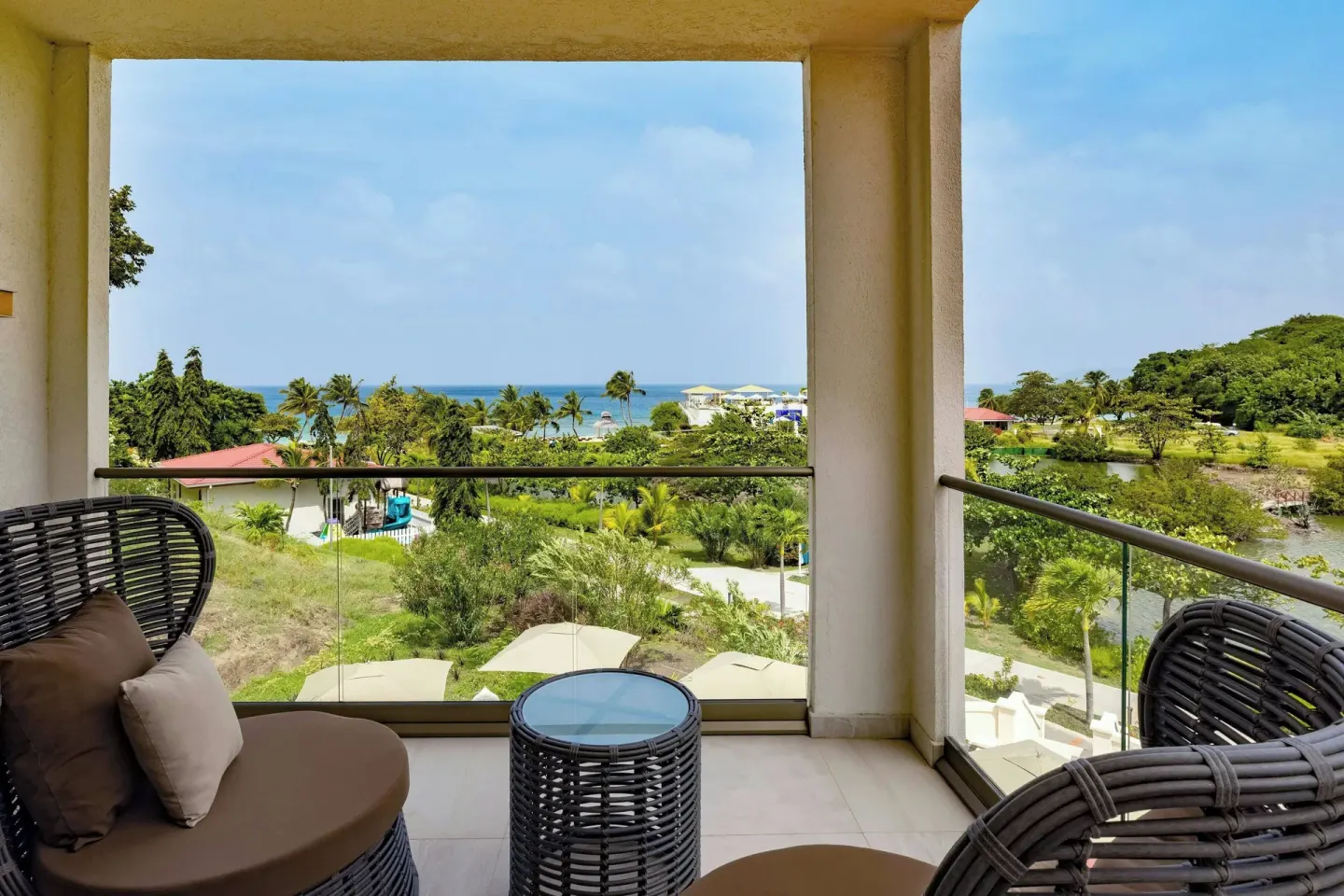 Balcony seating with garden and ocean view at Royalton Grenada.