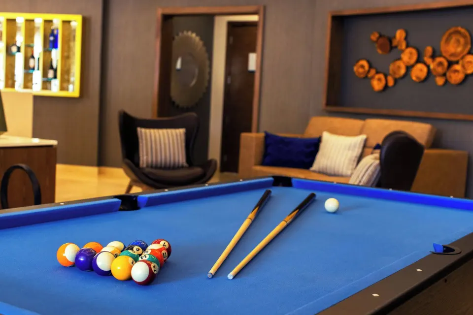 Chairman Two Bedroom Suite game room with blue pool table at Royalton Grenada.
