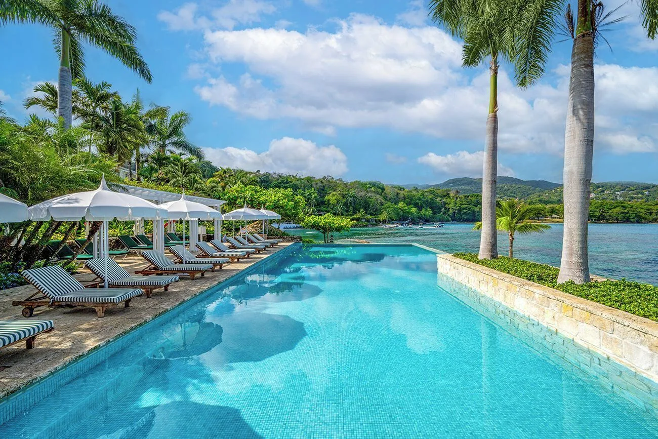 Round Hill Hotel and Villas luxury boutique resort in Montego Bay Jamaica with historic villas, private beach, and lush tropical grounds.