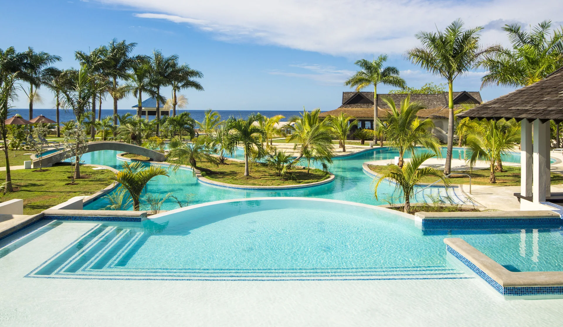 The Cliff Hotel boutique oceanfront resort in Negril Jamaica with intimate cliffside setting and Caribbean Sea views.