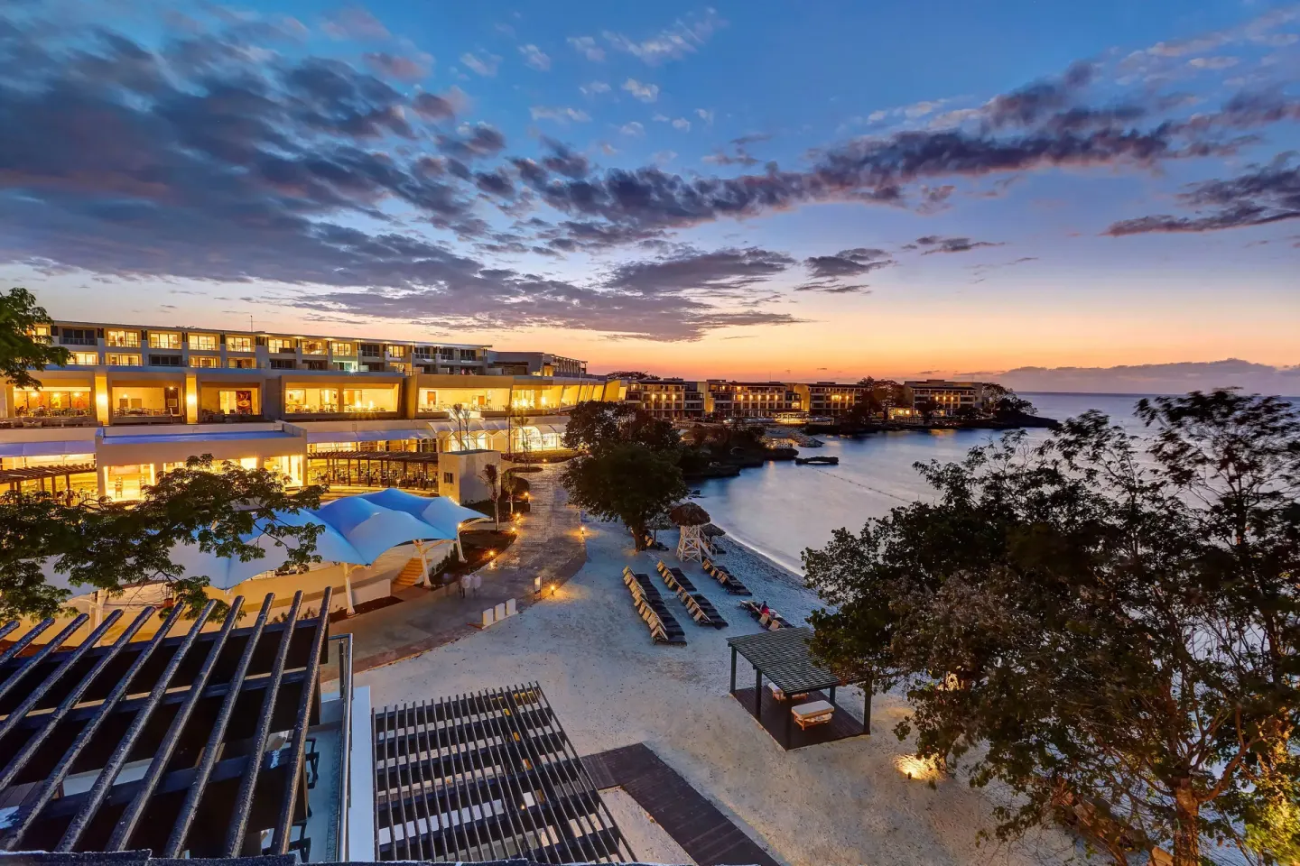Sunset view over the beachfront resort buildings at Royalton Hideaway Negril.
