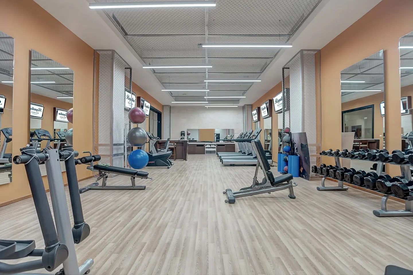 Fitness center with dumbbell racks, benches, and treadmills at Royalton Hideaway Negril.