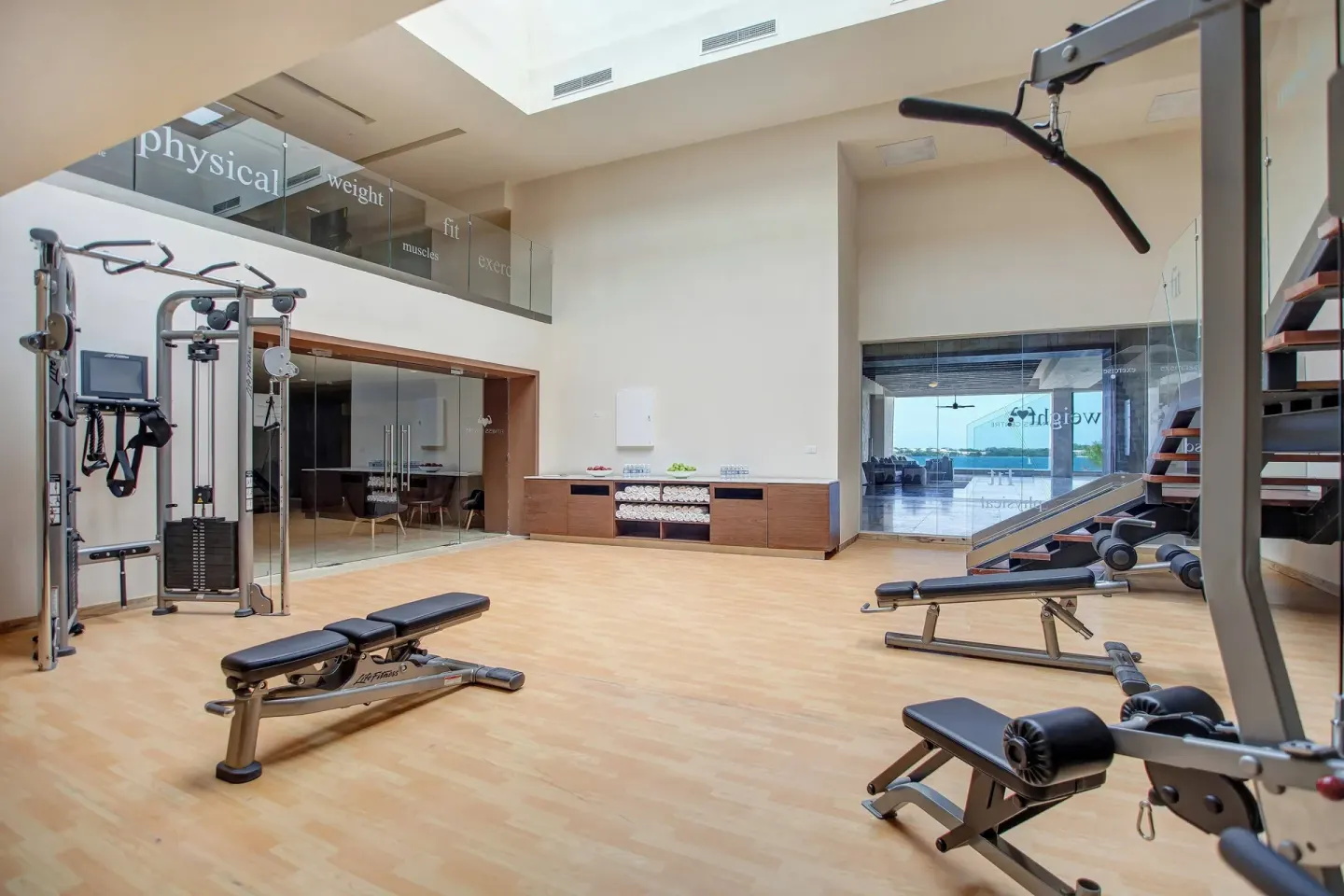 Gym strength-training area with cable machines and benches at Royalton Hideaway Negril.