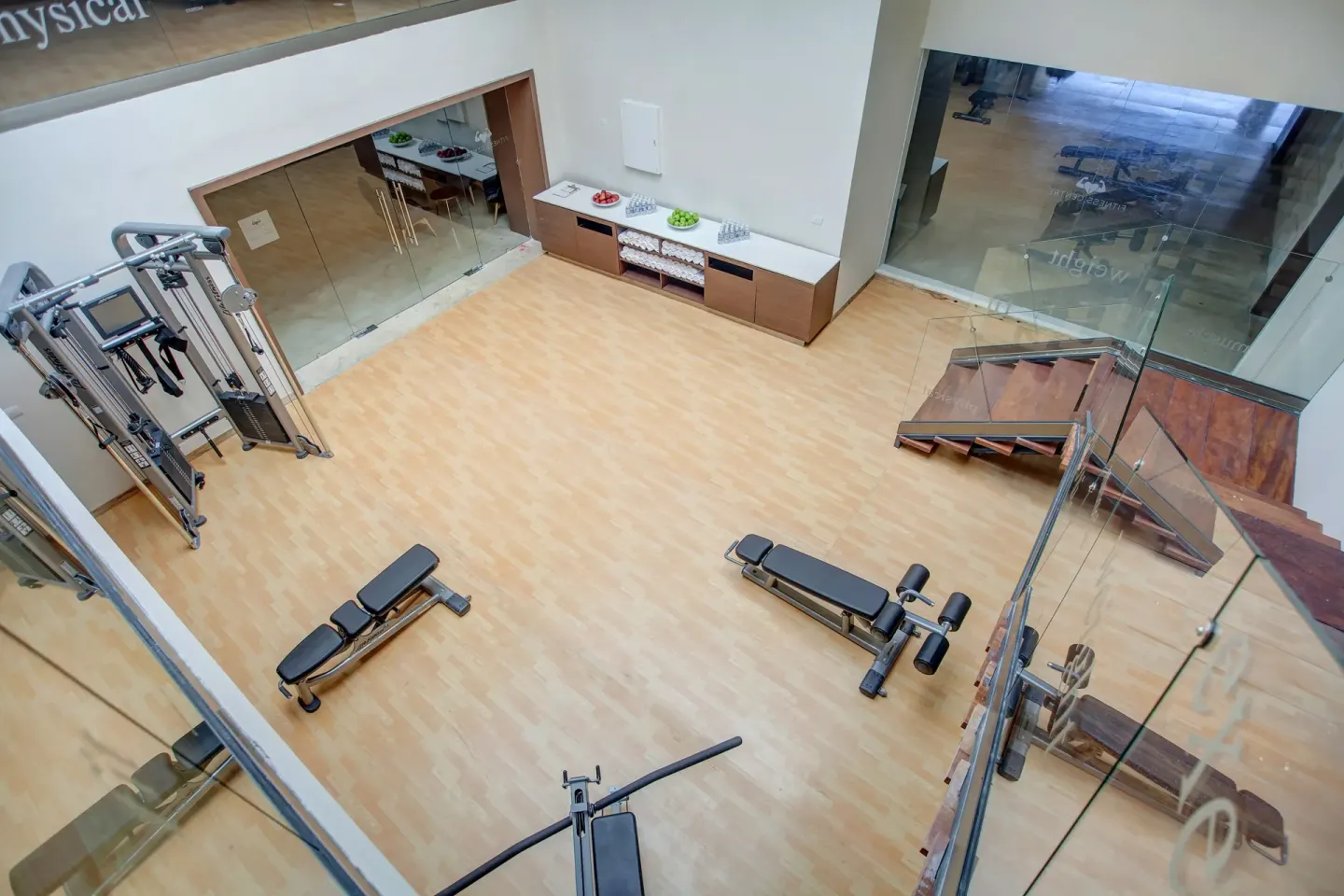 Overhead view of gym benches, cable equipment, and stairs at Royalton Hideaway Negril.