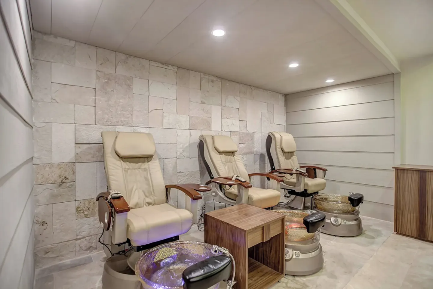 Pedicure chairs with foot basins in the spa salon at Royalton Hideaway Negril.