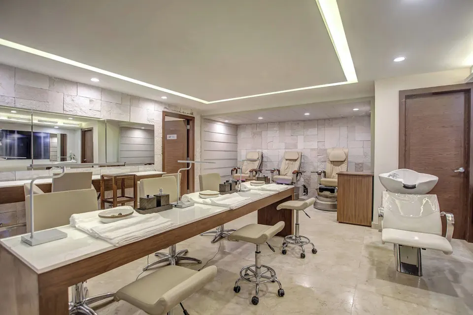 Salon manicure tables, pedicure chairs, and a shampoo station at Royalton Hideaway Negril.