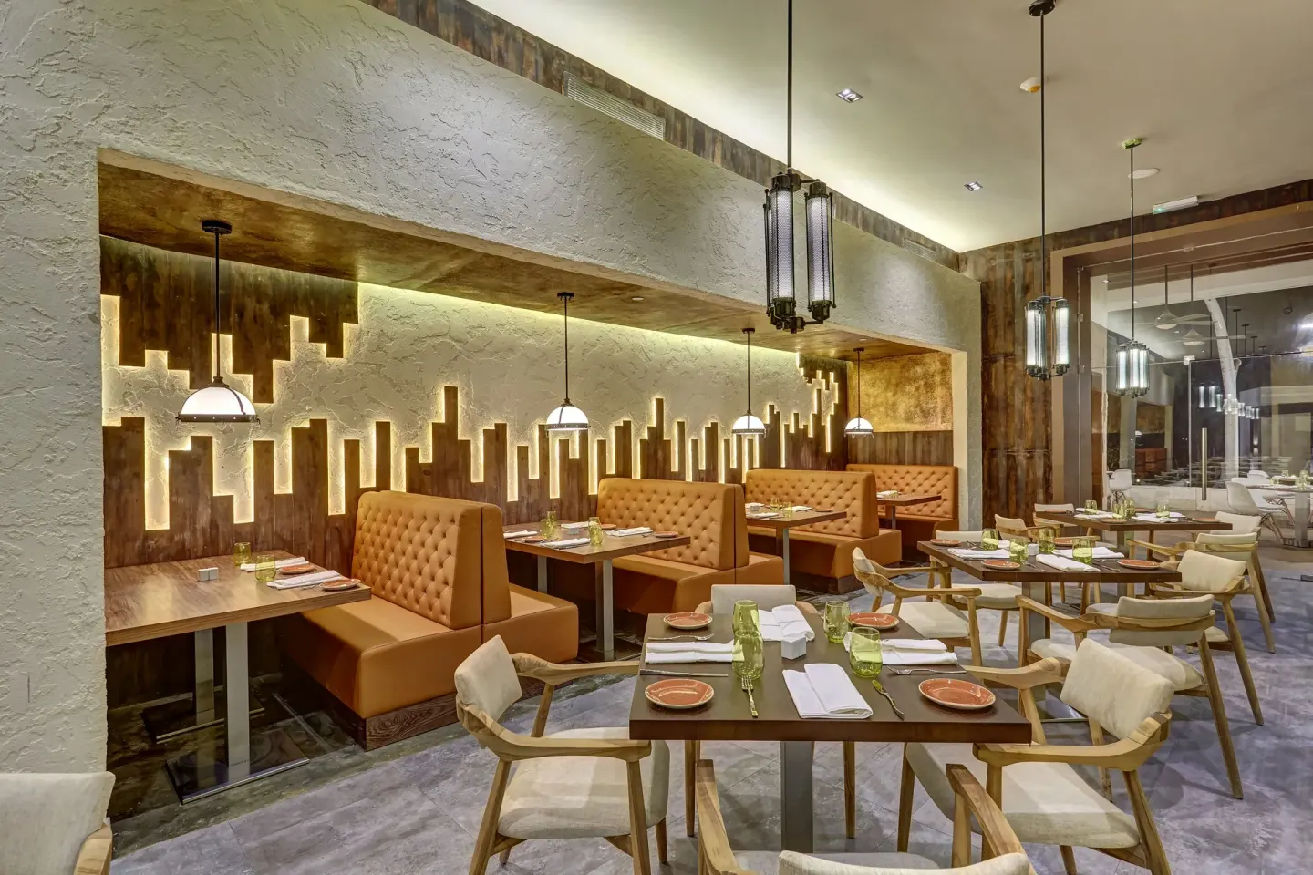 Tex-Mex restaurant seating with leather booths at Royalton Hideaway Negril.
