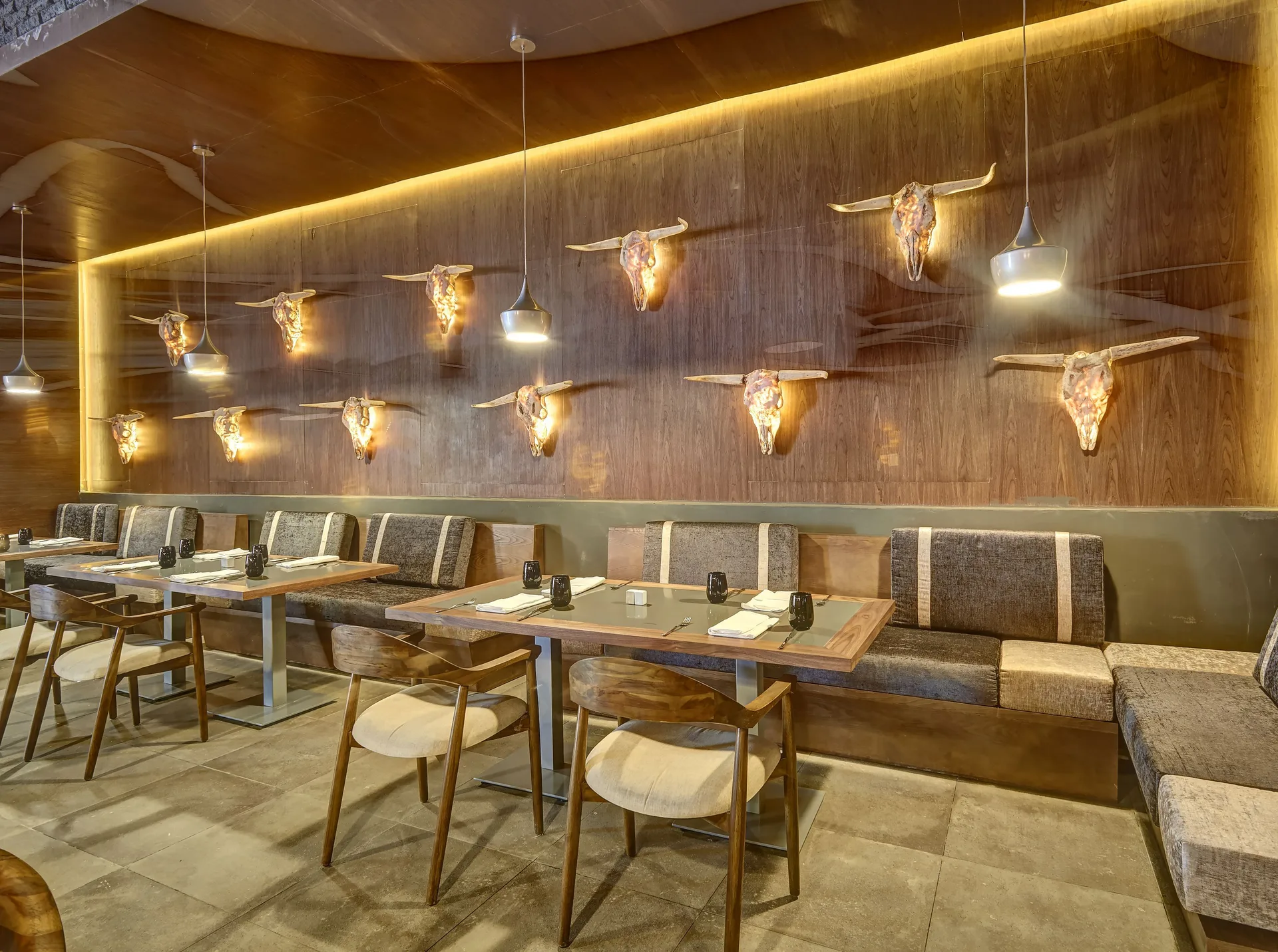 Steakhouse dining area with bull skull wall decor at Royalton Hideaway Negril.