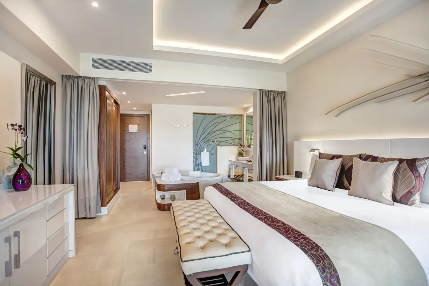 Luxury Junior Suite Ocean View king bed and open bath area at Royalton Hideaway Negril.