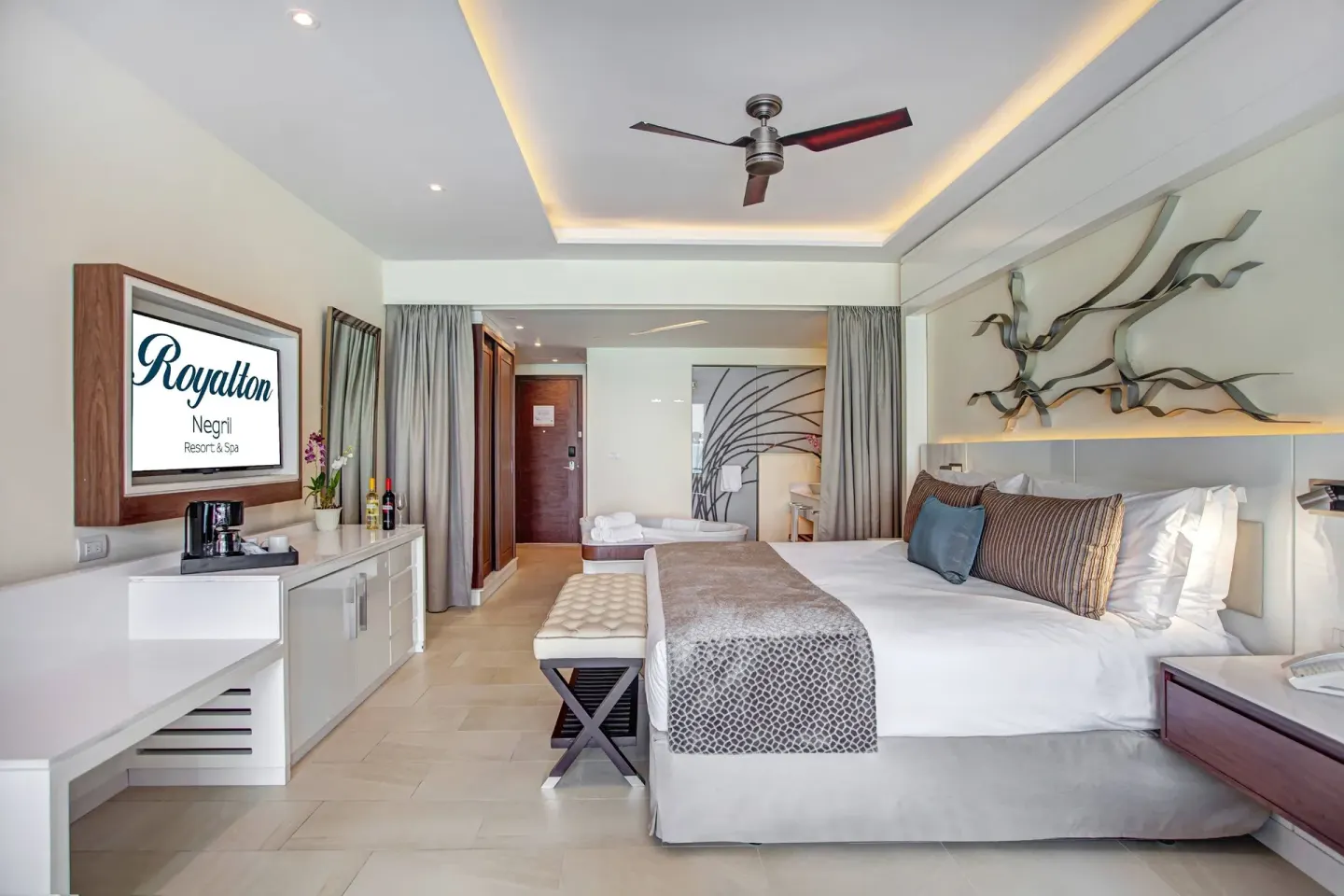 Luxury Junior Suite Ocean View with king bed and vanity area at Royalton Hideaway Negril.