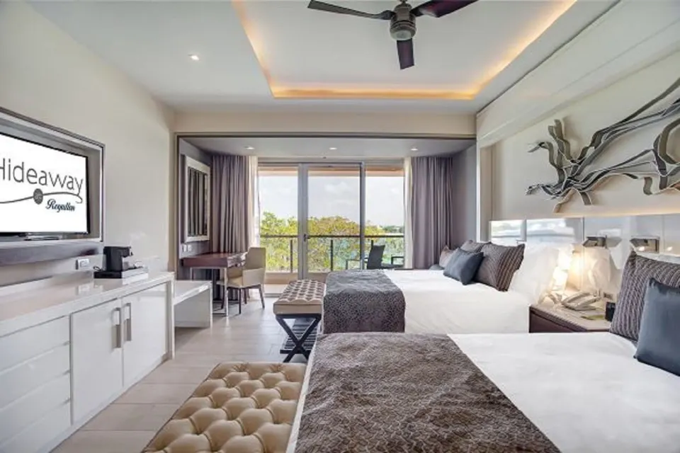 Luxury Junior Suite Ocean View with two beds and balcony at Royalton Hideaway Negril.