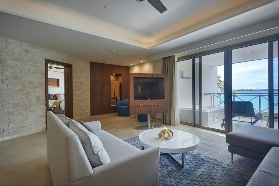 Penthouse living room with balcony ocean view at Royalton Hideaway Negril.