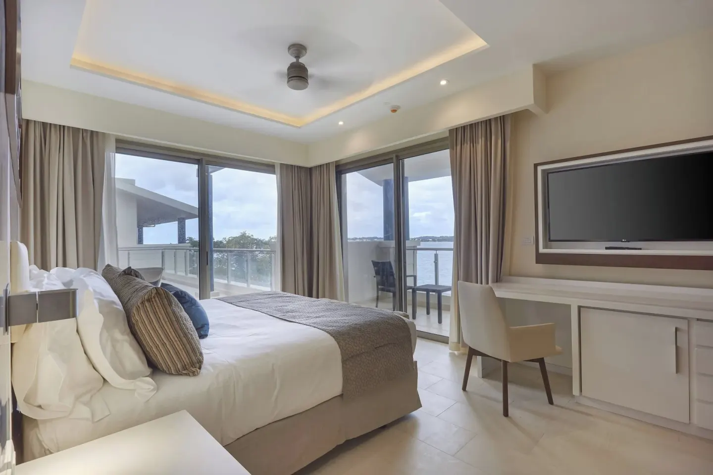 Penthouse king bedroom with balcony and ocean view at Royalton Hideaway Negril.