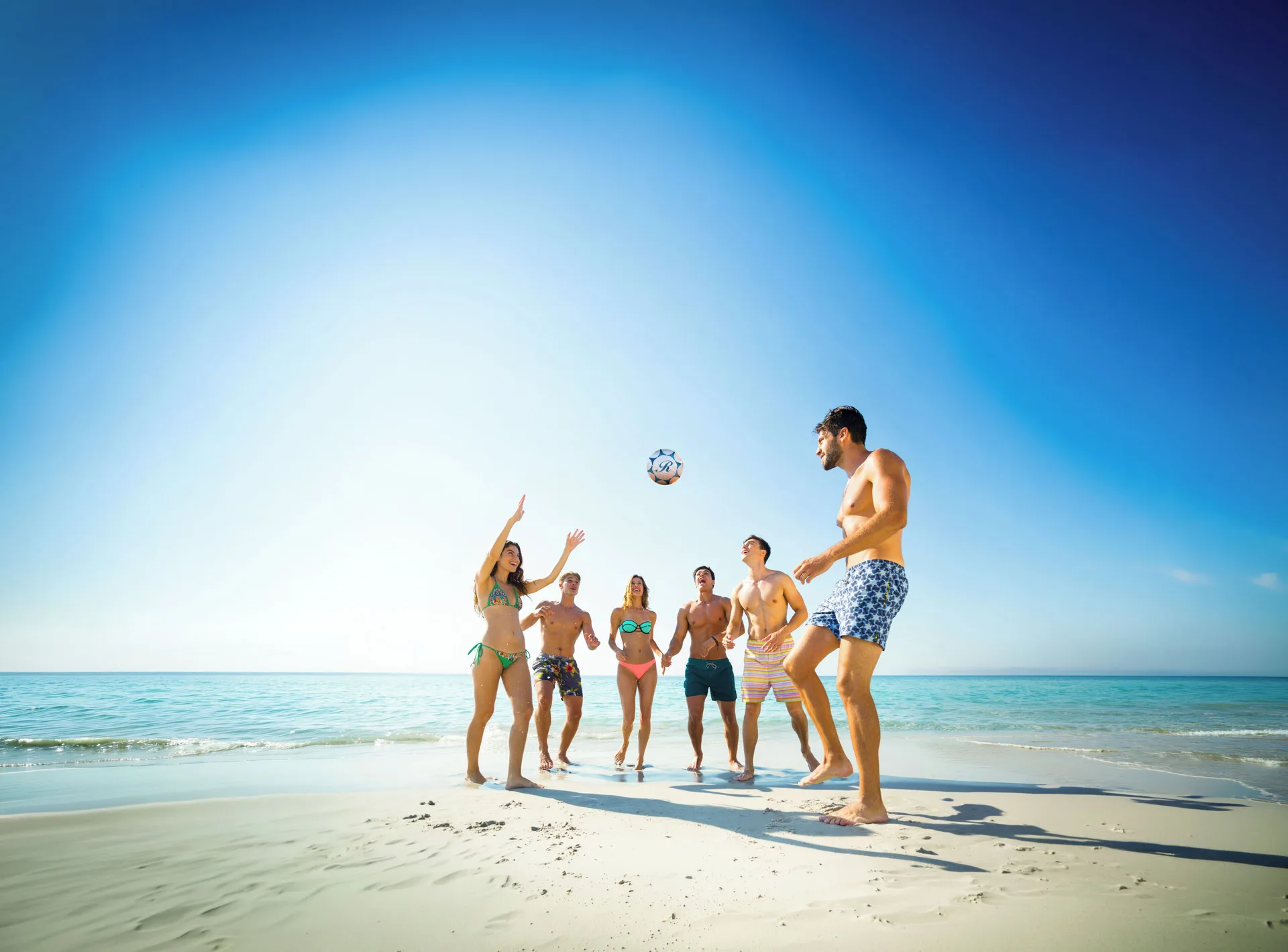 Guests playing soccer on the beach at Royalton Hideaway Punta Cana Resort & Casino.