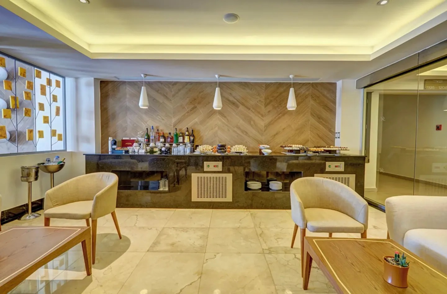Lounge buffet counter with armchairs at Royalton Hideaway Punta Cana Resort & Casino.