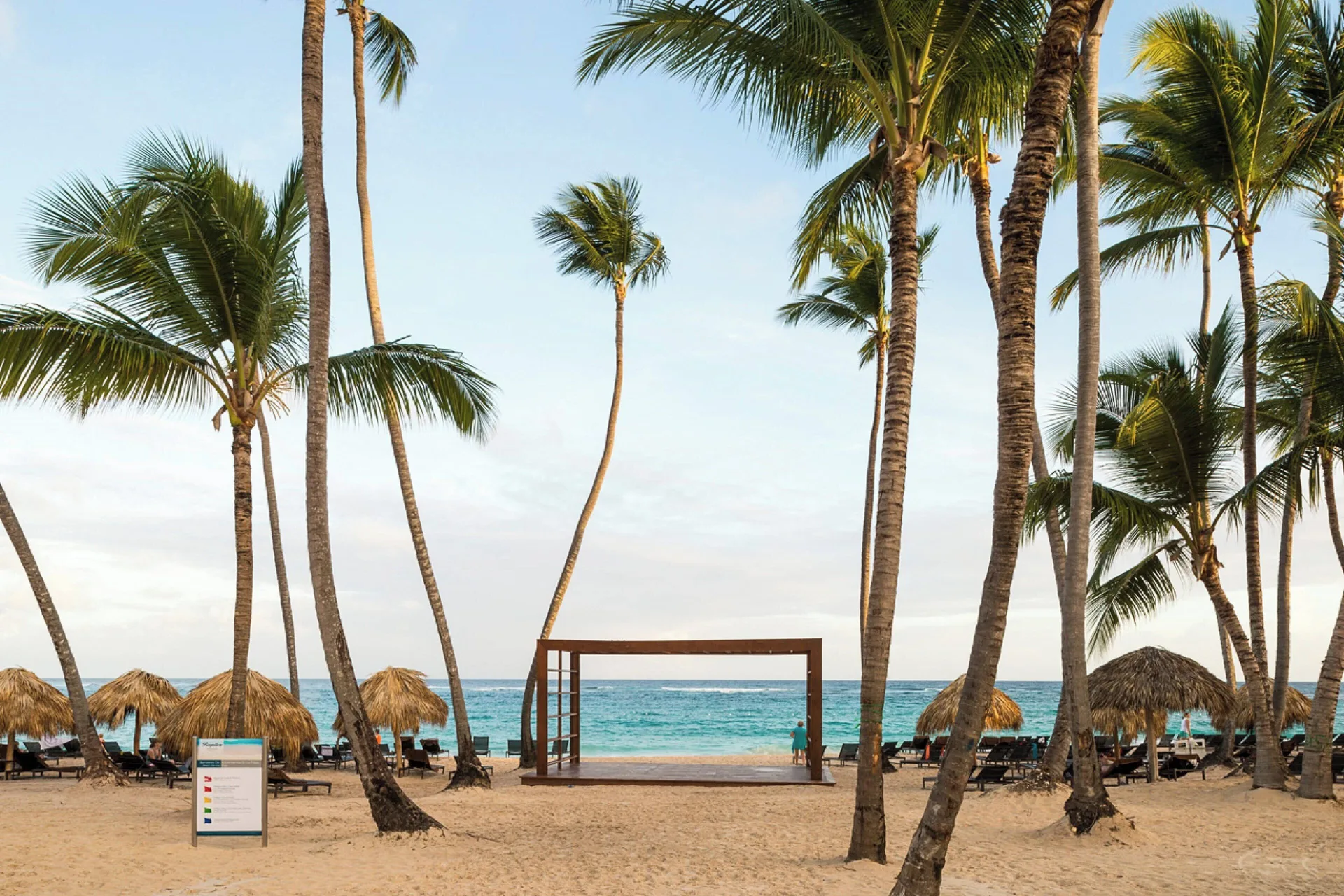 Palm-lined beach and turquoise ocean at Royalton Hideaway Punta Cana Resort & Casino.