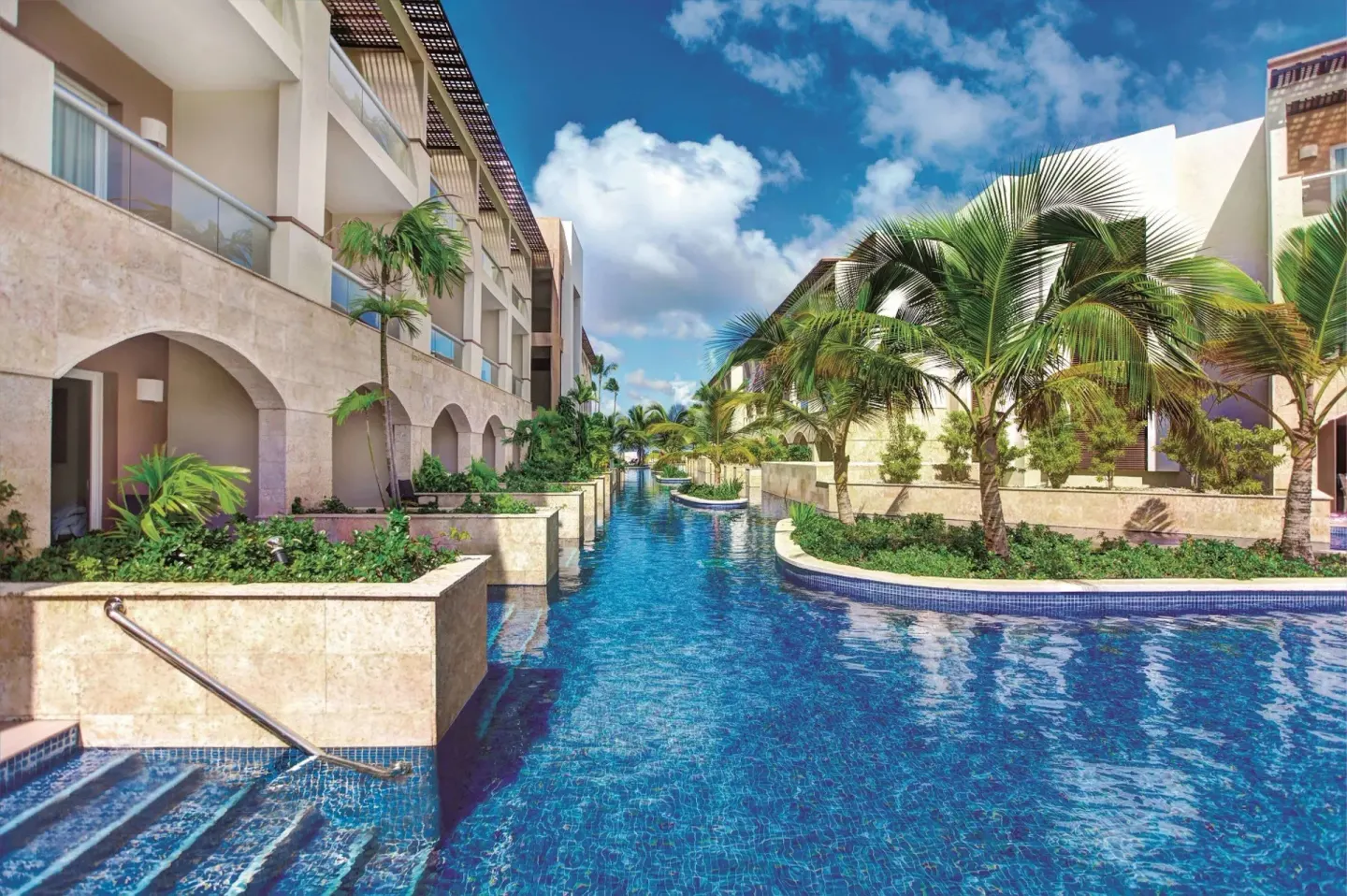 Swim-up pool channel between guest buildings at Royalton Hideaway Punta Cana Resort & Casino.