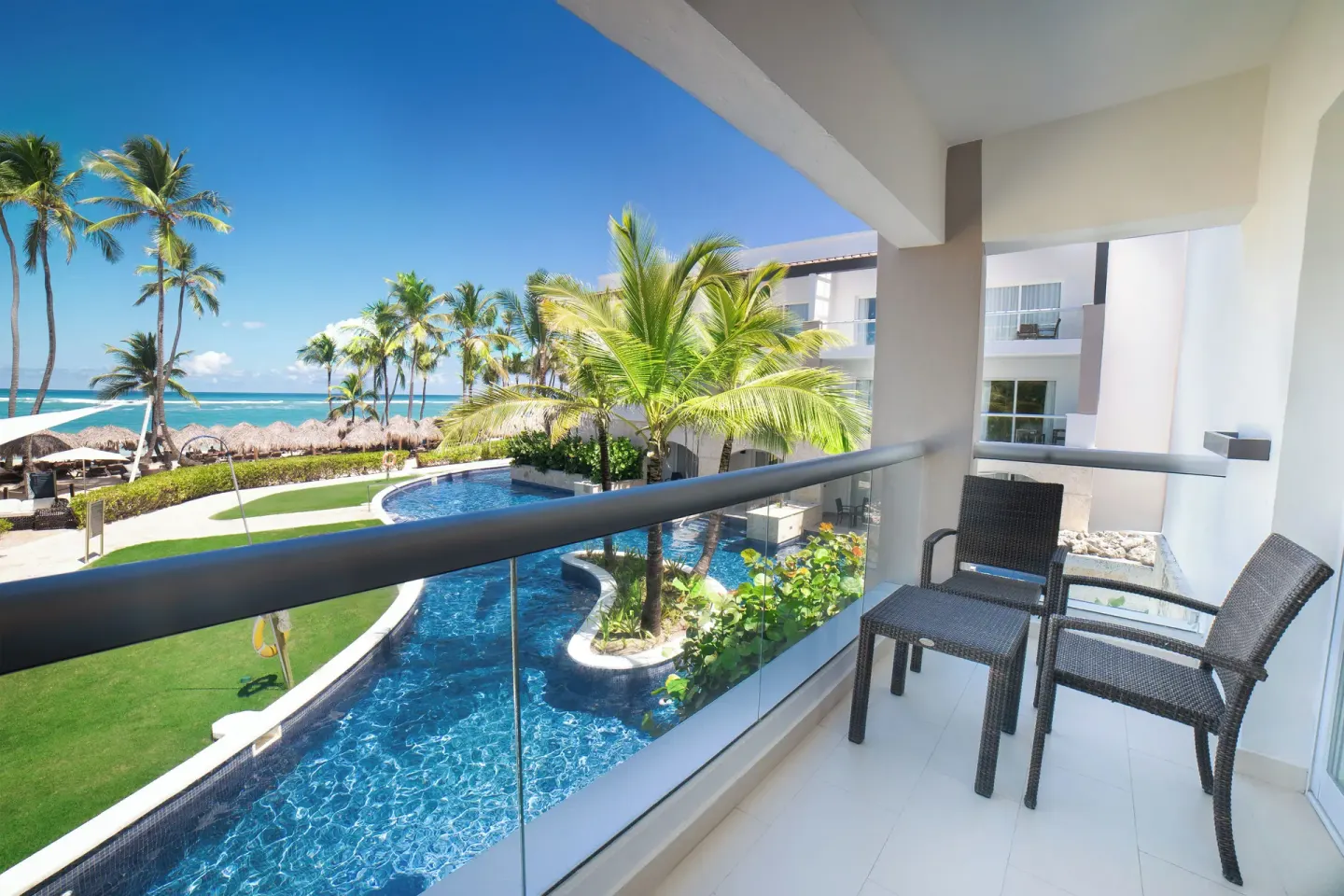 Balcony of the Honeymoon Jacuzzi Suite Diamond Club at Royalton Hideaway Punta Cana Resort & Casino with pool and ocean view.