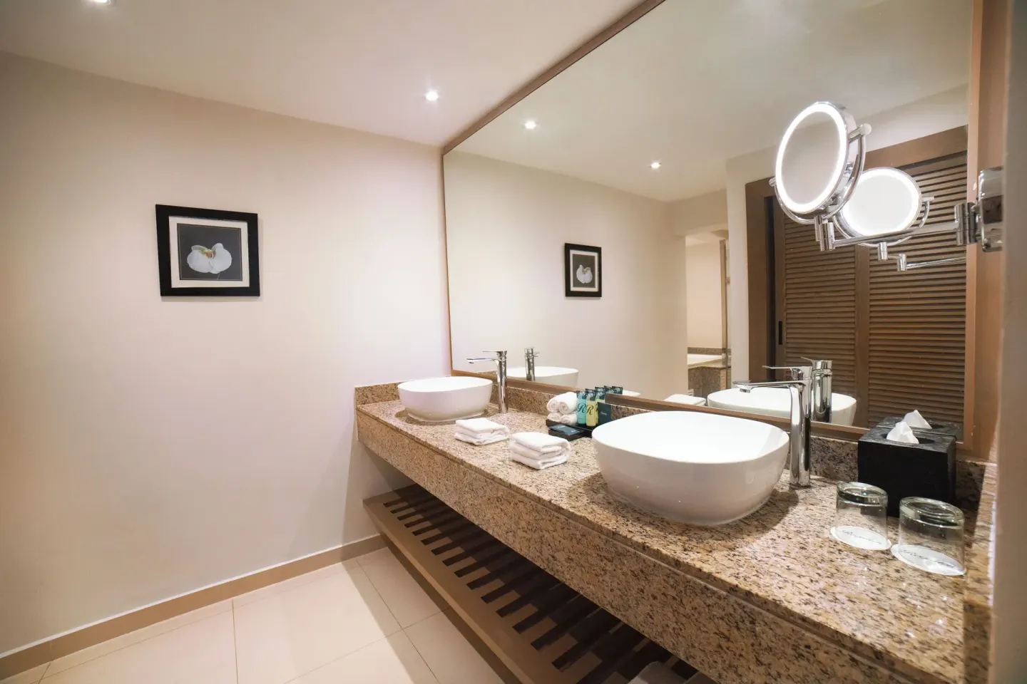 Bathroom vanity in the Honeymoon Jacuzzi Suite Diamond Club at Royalton Hideaway Punta Cana Resort & Casino with two vessel s