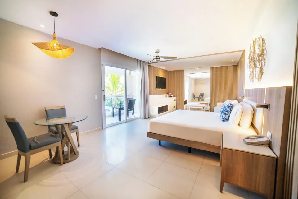 Honeymoon Jacuzzi Suite Diamond Club at Royalton Hideaway Punta Cana Resort & Casino with king bed, dining table, and balcony