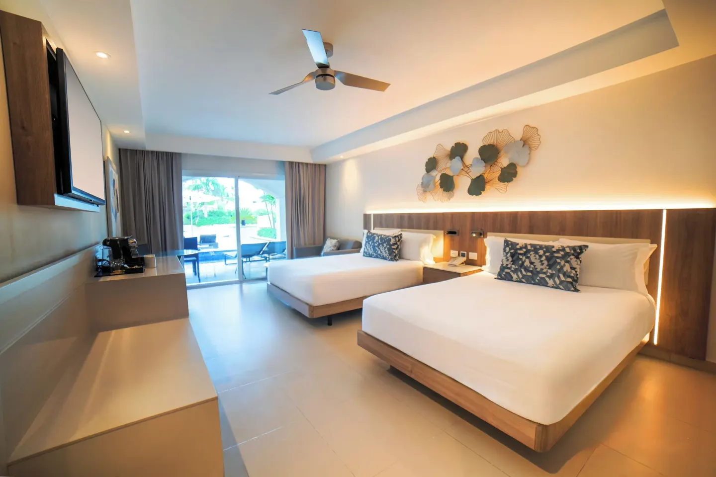 Luxury Room with two beds and balcony doors at Royalton Hideaway Punta Cana Resort & Casino.