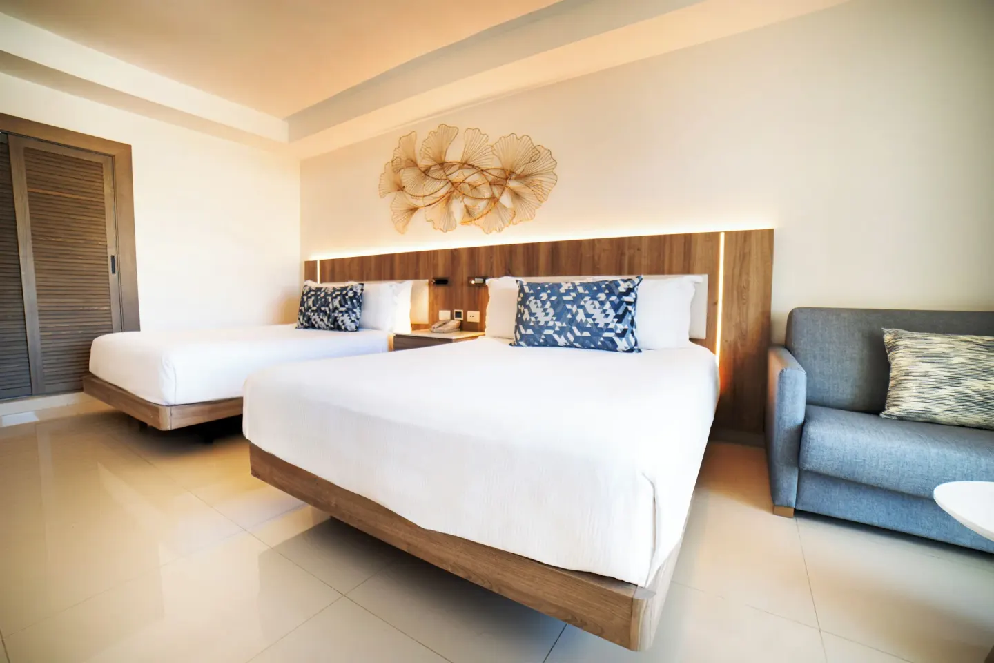 Luxury Room two beds with sofa detail at Royalton Hideaway Punta Cana Resort & Casino.