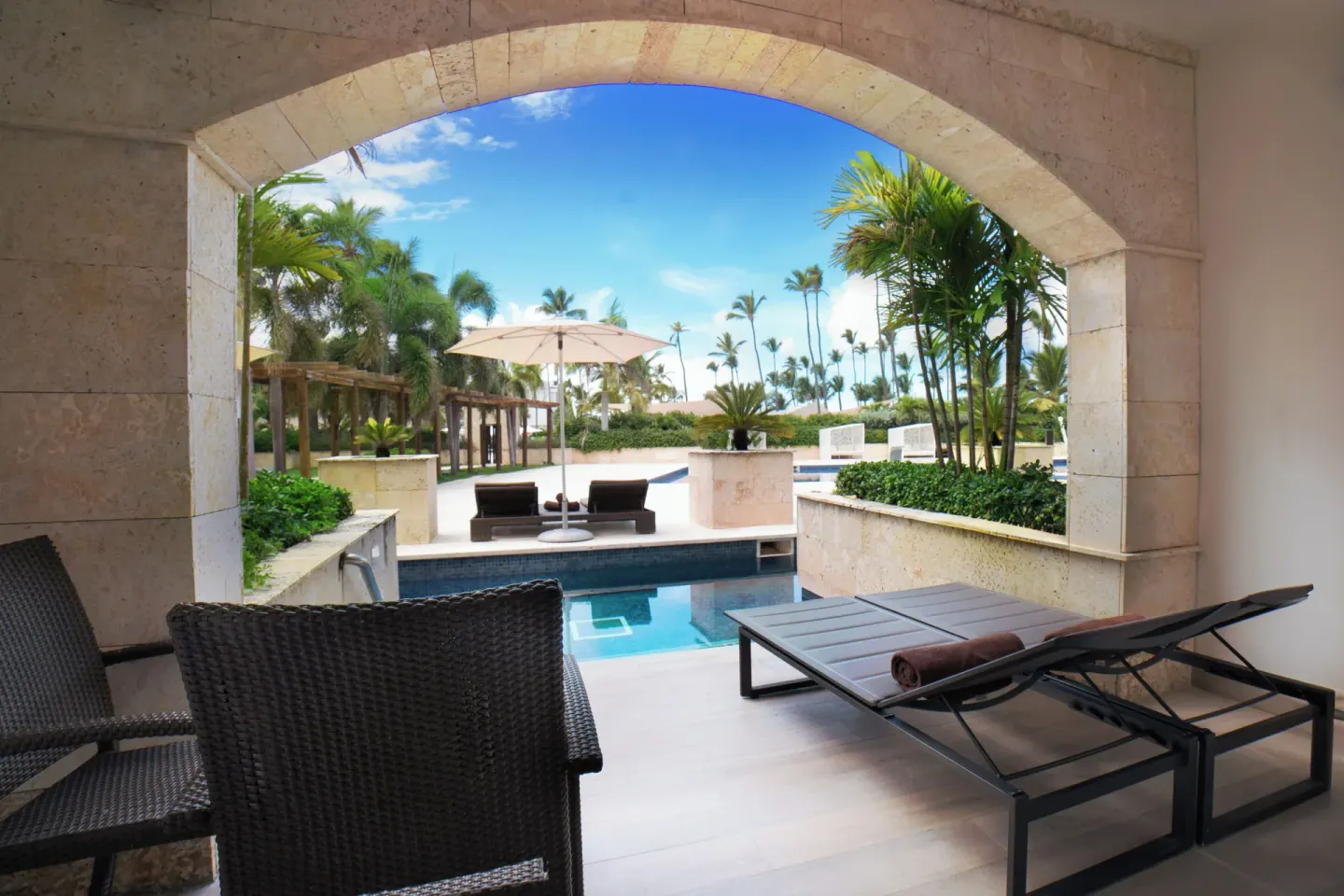 Covered swim-out terrace with loungers at Royalton Hideaway Punta Cana Resort & Casino.