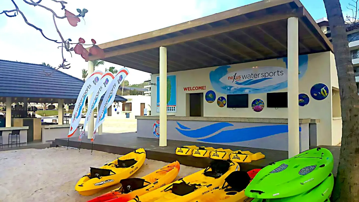 Beach watersports hut with colorful kayaks at Royalton Hideaway Saint Lucia.