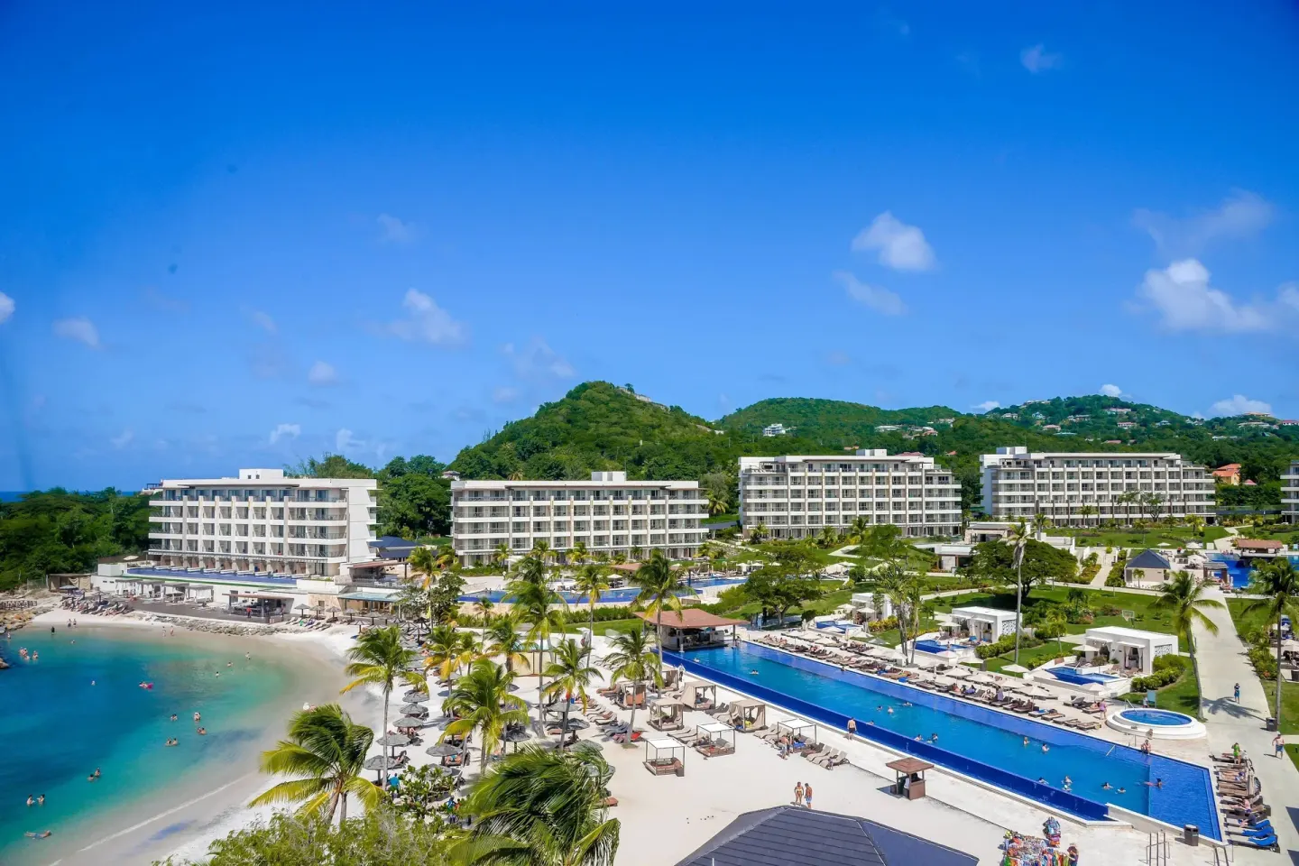Aerial view of beachfront pools and resort buildings at Royalton Hideaway Saint Lucia.