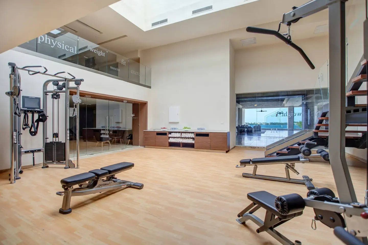 Fitness center with strength equipment and benches at Royalton Hideaway Saint Lucia.