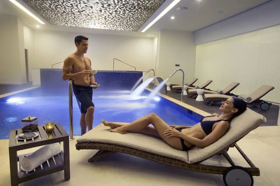 Indoor spa pool with loungers and water jets at Royalton Hideaway Saint Lucia.
