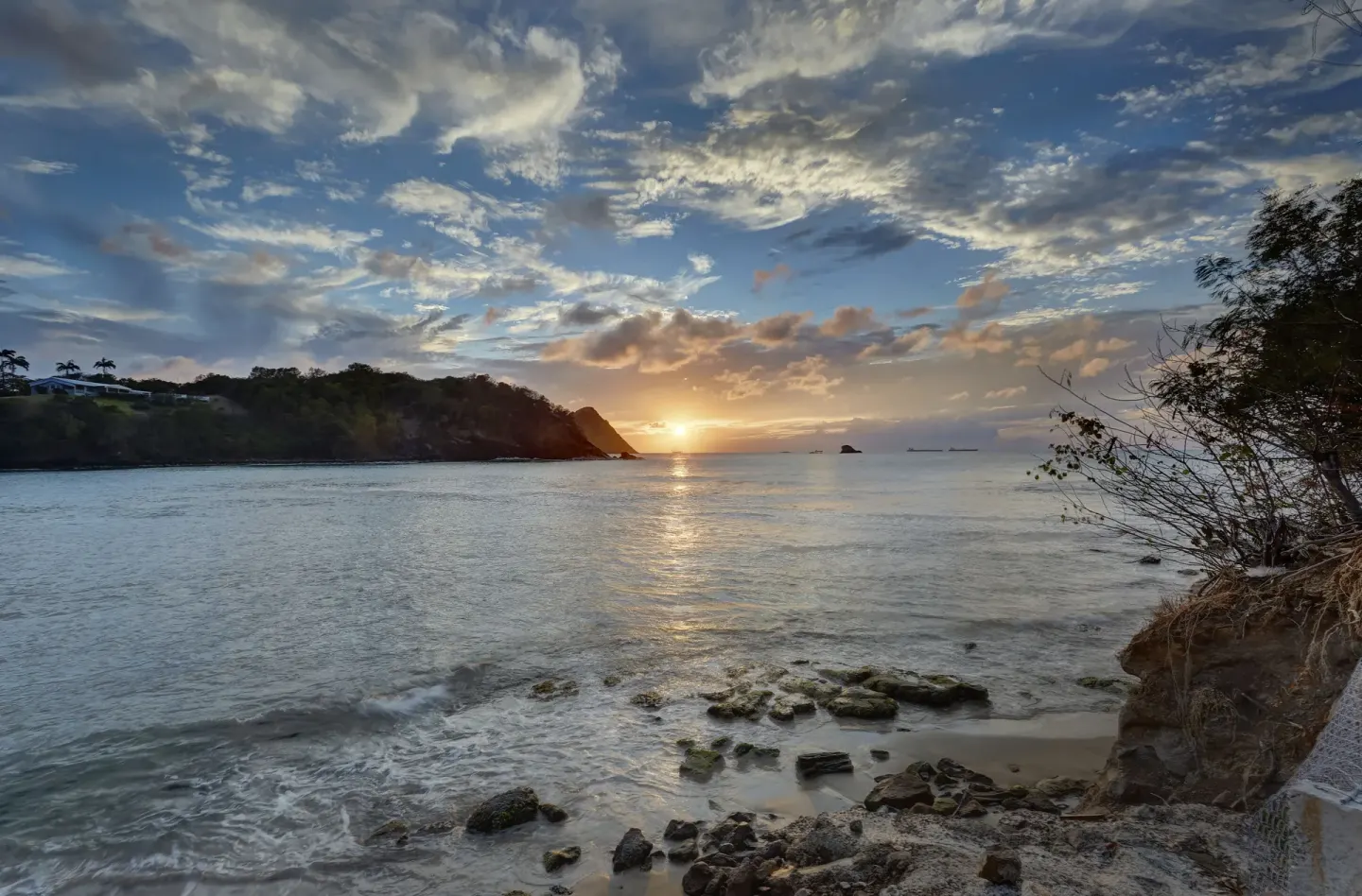 Sunset over a rocky cove near Royalton Hideaway Saint Lucia.