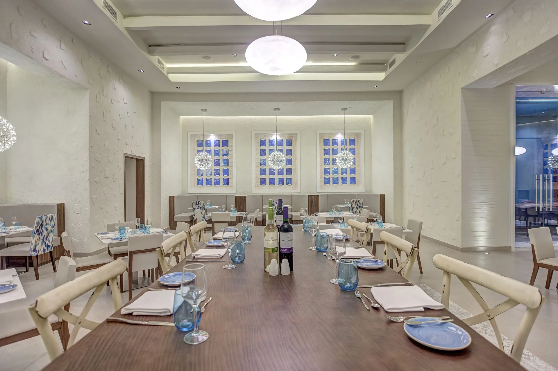 Bright restaurant dining room with a long set table at Royalton Hideaway Saint Lucia.
