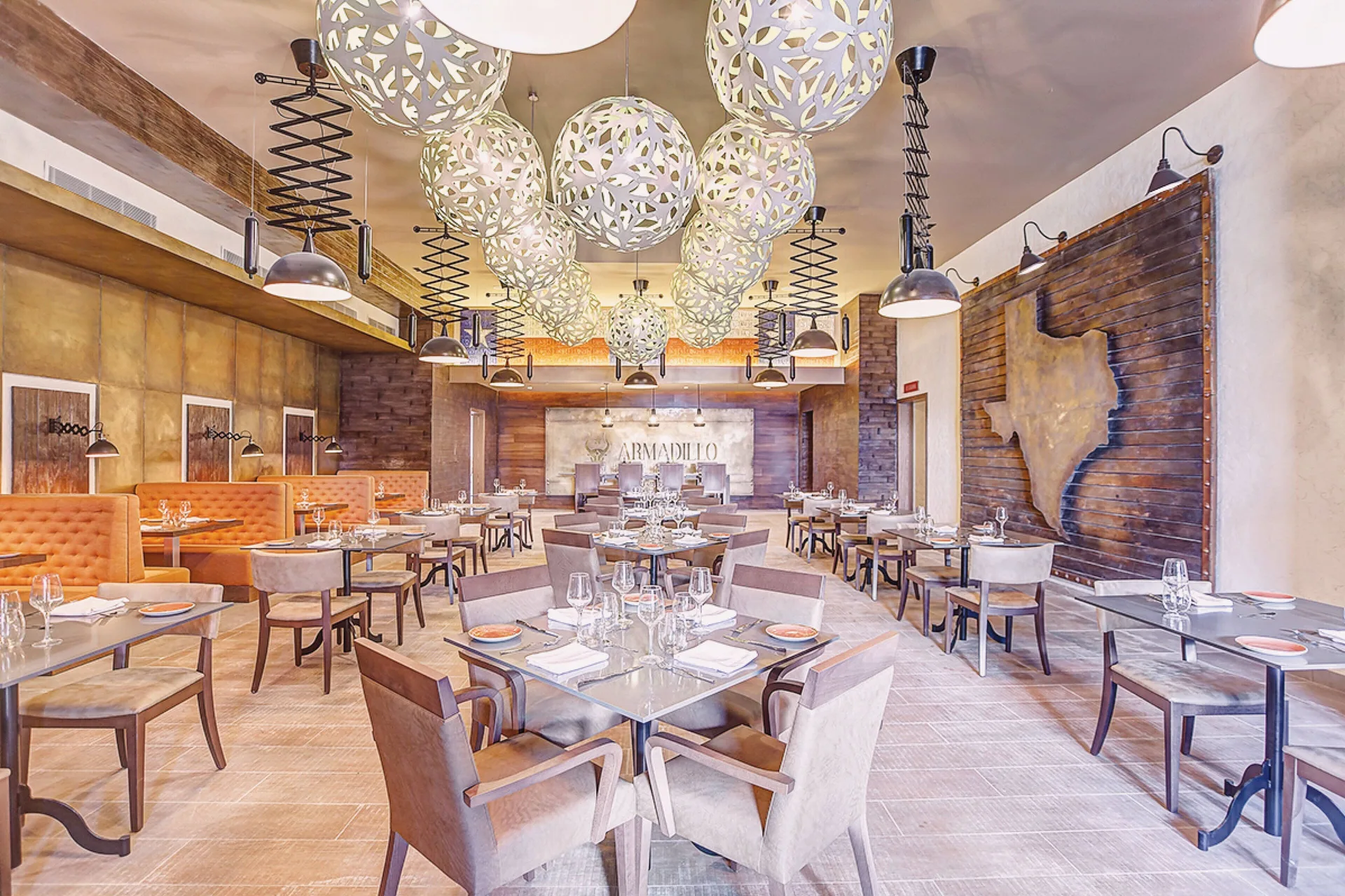 Steakhouse dining room with cowhide wall art at Royalton Hideaway Saint Lucia.