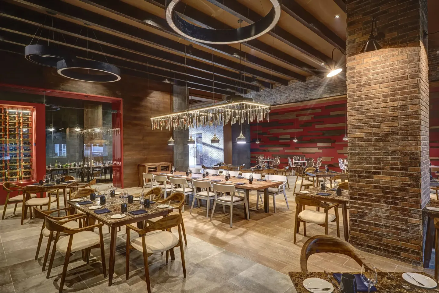 Steakhouse-style dining room with brick accents at Royalton Hideaway Saint Lucia.