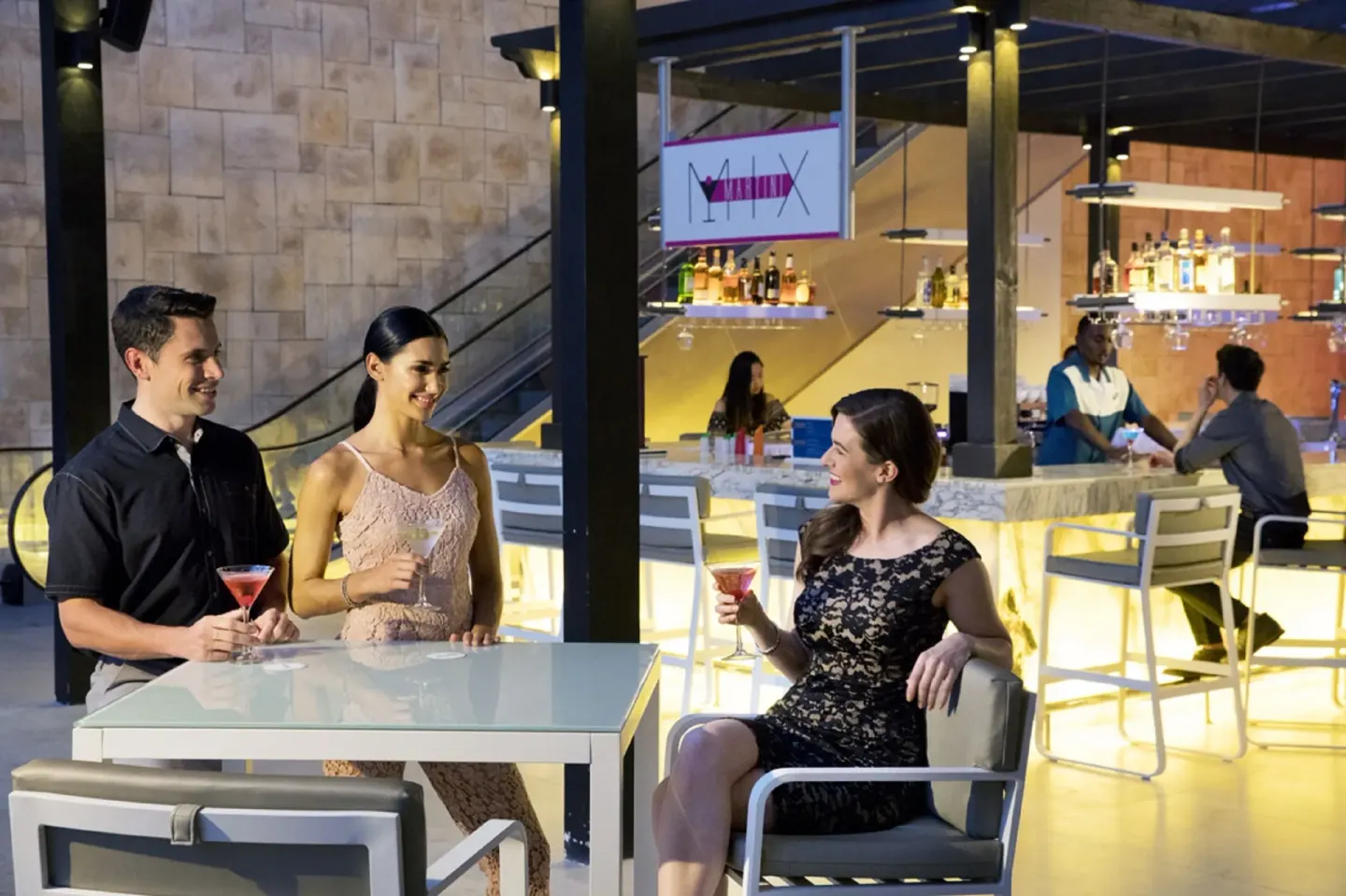 Guests with cocktails at Martini Mix bar at Royalton Hideaway Saint Lucia.