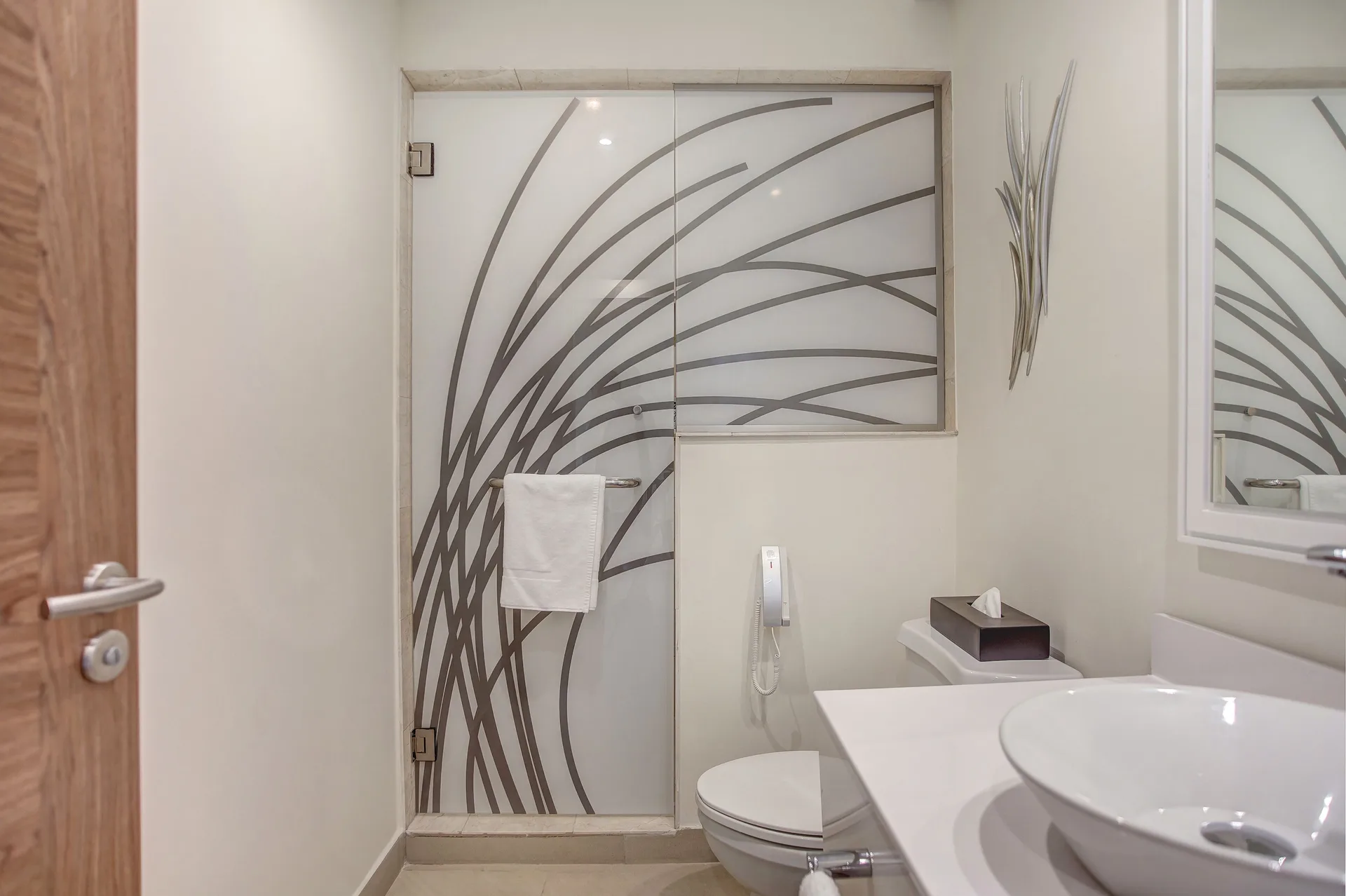 Glass shower, toilet, and vanity in a Diamond Club swim-out suite at Royalton Hideaway Saint Lucia.