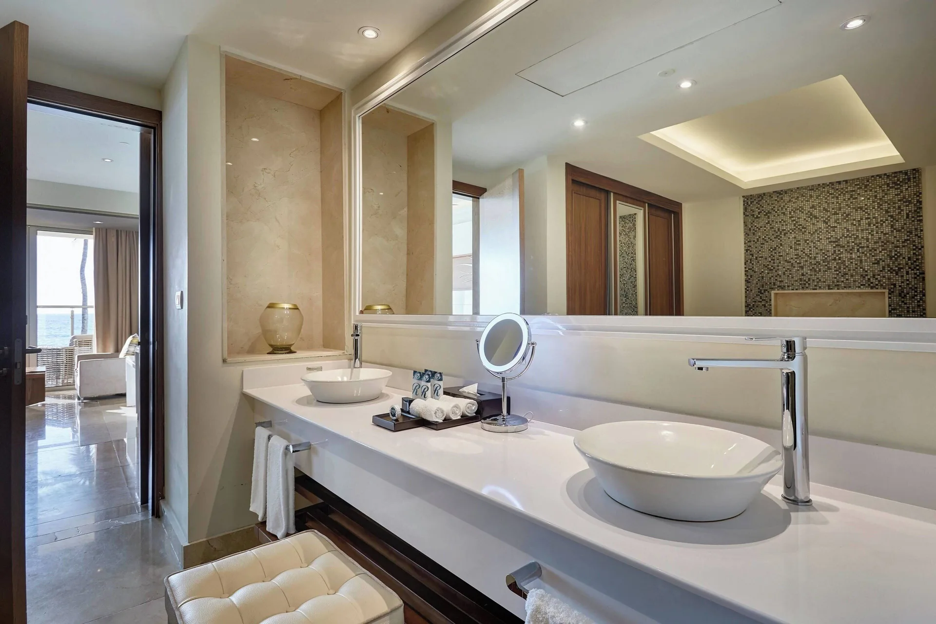 Close-up of double vanity with vessel sinks and mirror at Royalton Hideaway Saint Lucia.