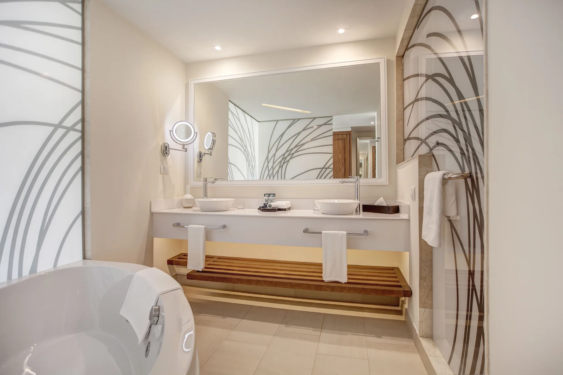 Two-bedroom oceanfront Chairman's suite bathroom at Royalton Hideaway Saint Lucia with tub and double vanity.